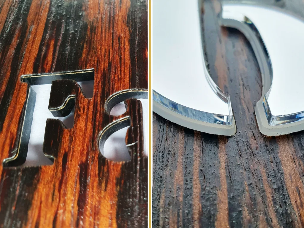 Detail van laser uitgesneden fineer en spiegelplexiglas cijfer van een Wooddes huisnummerbord